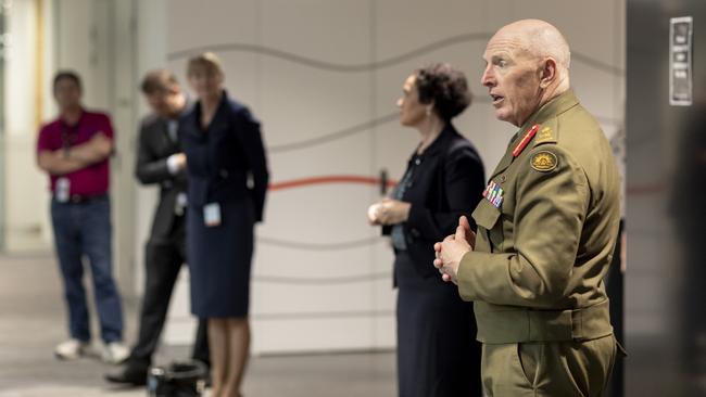 Commander of the Defence COVID-19 Taskforce Assist Lieutenant General John Frewen and the Deputy Secretary of Defence People Group, Justine Greig (third from left), met Defence civilians who have been redeployed to Services Australia in Canberra. Picture: Defence