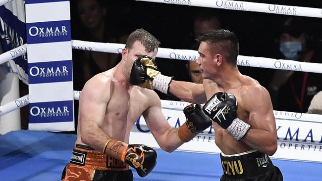 TOWNSVILLE, AUSTRALIA - AUGUST 26: Tim Tszyu hits Jeff Horn during the WBO Global &amp; IBF Australasian Super Welterweight title bout at QCB Stadium on August 26, 2020 in Townsville, Australia. (Photo by Ian Hitchcock/Getty Images)