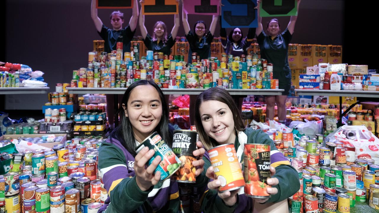 Centenary Heights State High School student council president Ria Biscocho and vice president Lily Pederick. Food donation to Lifeline Darling Downs.