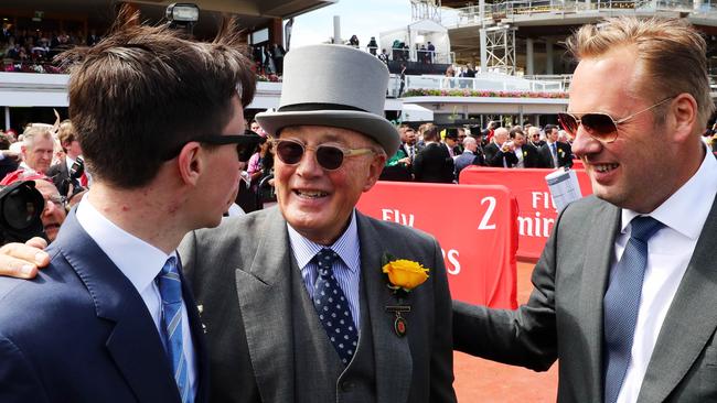 Owners Lloyd Williams (centre) and Nick Williams (right) congratulate Rekindling’s trainer, Joseph O'Brien. Photo: Aaron Francis