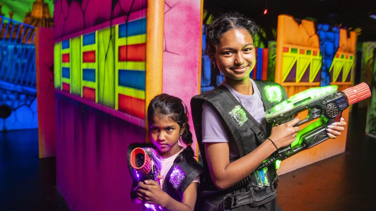 Mithra Saranya (left) and Nereshana Navin Raj in the laser tag maze at iPlay Toowoomba Bowl for school holiday fun, Monday, January 9, 2023.