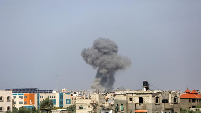 Smoke billows near the Rafah crossing with Egypt on the southern Gaza Strip on October 23, 2023, amid ongoing battles between Israel and the Palestinian group Hamas. Picture: Eyad Baba / AFP)