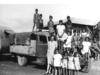 UNDATED : Early undated copy photo of Lorna Cubillo (far R) seated on truck fender outside Retta Dixon home in Darwin, Cubillo one of two people suing Commonwealth for damages & compensation in Darwin's Federal Court 08/99. Pic Ex Darwin.Northern Territory / Aborigines / Stolen Generation