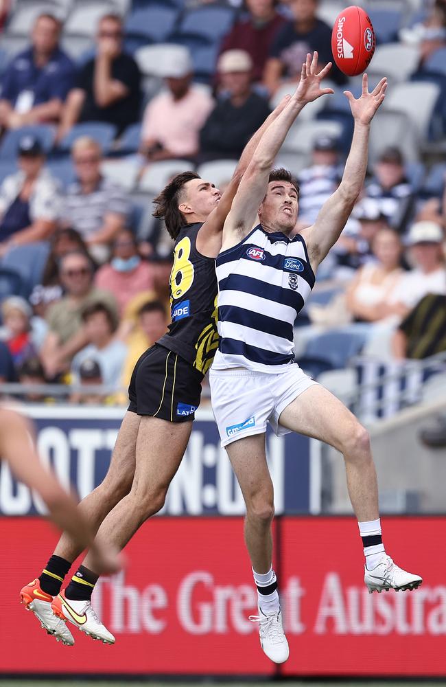 Tigers draftee Josh Gibcus attempts to spoil against Jeremy Cameron. Picture: Michael Klein