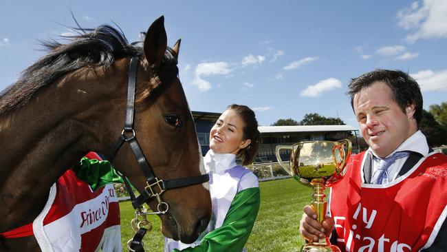 Michelle Payne with brother Stevie holding the 2015 Emirates Melbourne Cup. Picture: David Caird