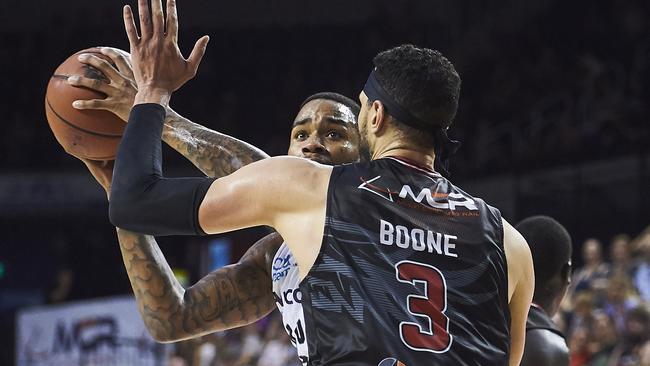 Melbourne United’s Shawn Long tries to push past Josh Boone.