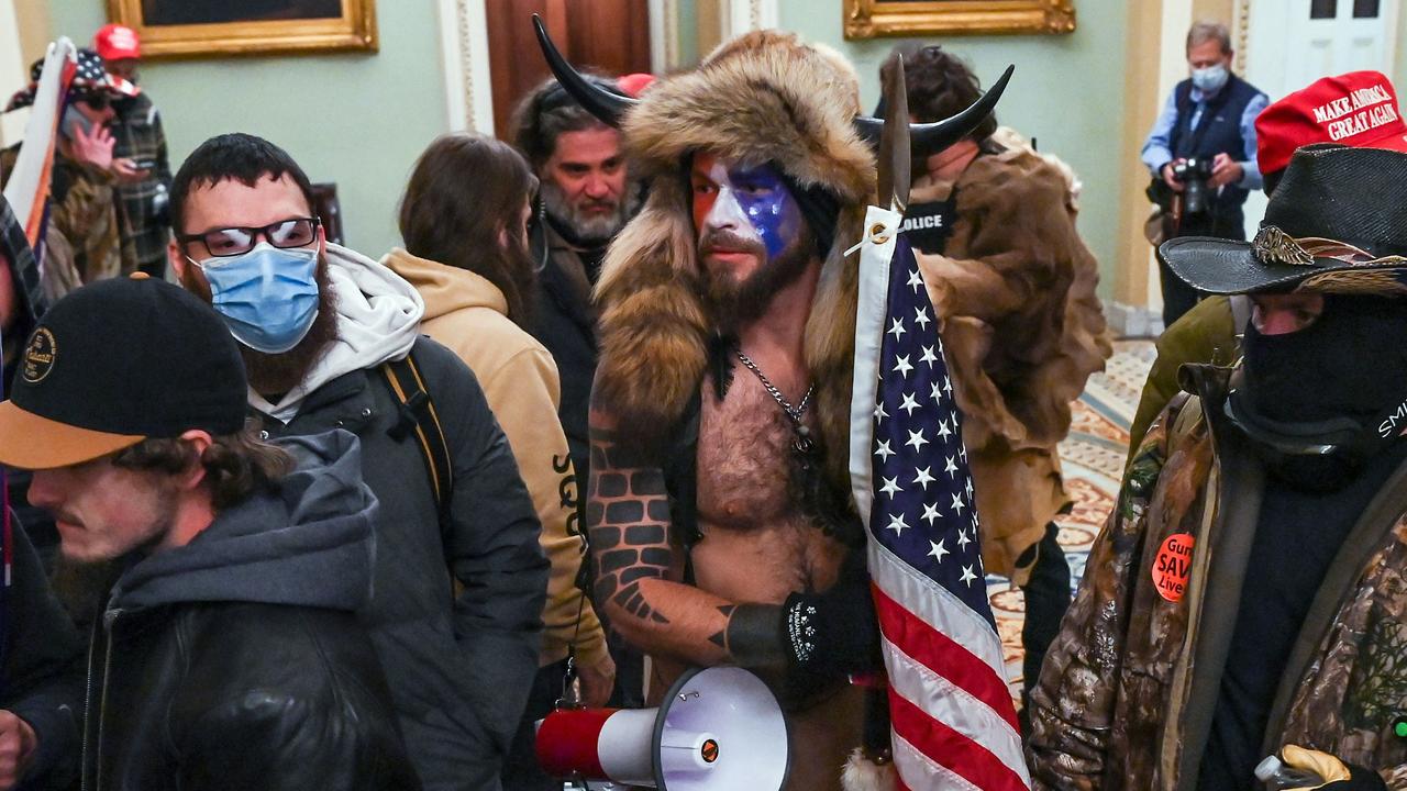 Authorities have announced a string of new arrests and charges over the violent incursion into the US Capitol, including Jacob Anthony Chansley, also known as Jake Angeli. Picture: AFP