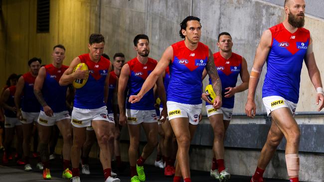 ADELAIDE, AUSTRALIA - AUGUST 05: Max Gawn of the Demons leads his team onto the ground during the round 10 AFL match between the Adelaide Crows and the Melbourne Demons at Adelaide Oval on August 05, 2020 in Adelaide, Australia. (Photo by Daniel Kalisz/Getty Images)