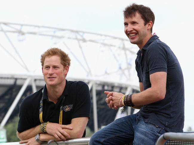 Prince Harry chats with singer James Blunt as he rehearses for the Invictus Games Closing Ceremony in 2014. Picture: Getty