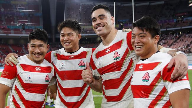 (L-R) Japan's fly-half Rikiya Matsuda, Japan's number 8 Kazuki Himeno, Samoa's lock Kane Le'aupepe and Japan's hooker Atsushi Sakate pose after the match on Saturday. Picture: AFP