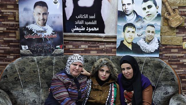 Asil al-Titi, 23, from the occupied West Bank is pictured with her mother and sister, one day after her release by Israel. Picture: AFP