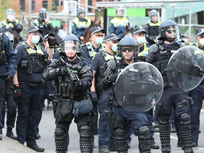 Riot police push back protesters. Picture: David Crosling