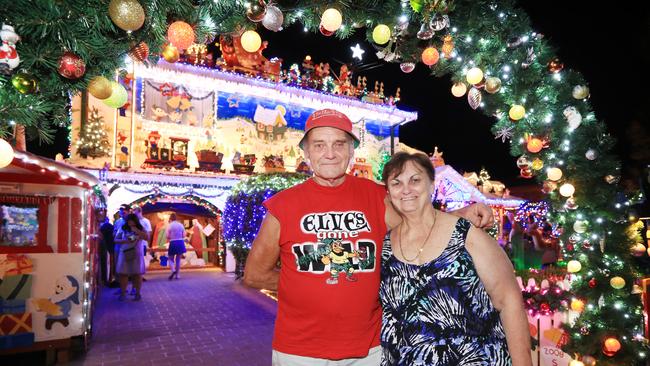 Proud owners Peter and Lauraine Overton in front of their amazingly-decorated home. Pictures: Christian Gilles