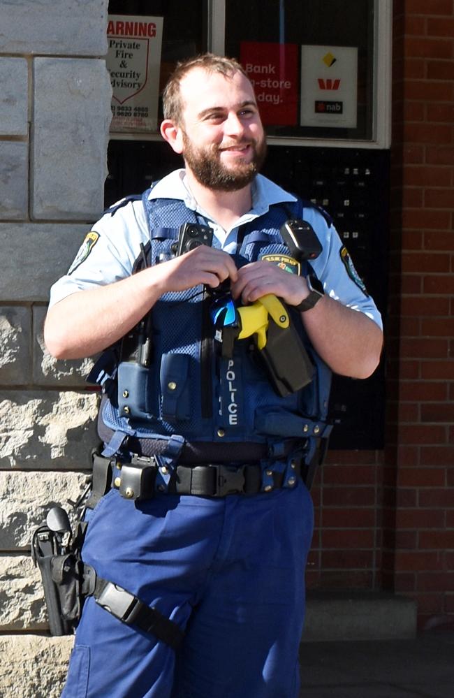 Then-Senior Constable Troy Cridland next to the old lock up outside Bonalbo Post Office.