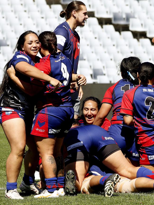 Campbelltown Collegians players celebrate their win at full time. Picture: John Appleyard