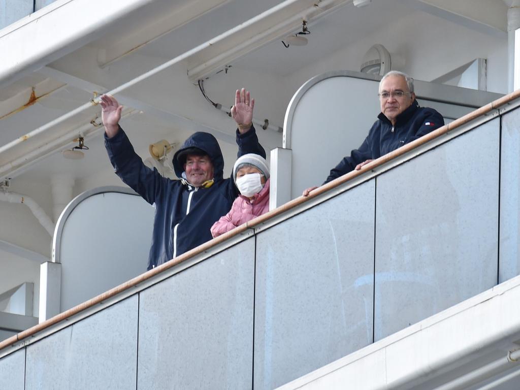 Passengers in lockdown wave from the Diamond Princess. Picture: Kazuhiro Nogi/AFP