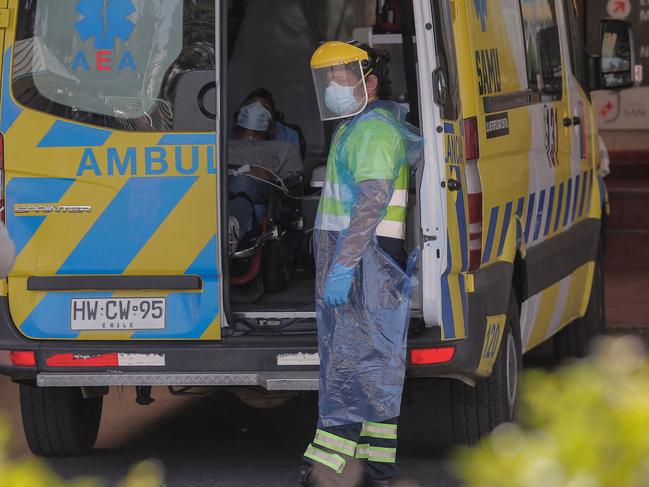 A patient with symptoms of COVID-19 waits inside an ambulance to be admitted at San Jose Hospital, in Santiago. Picture: AFP