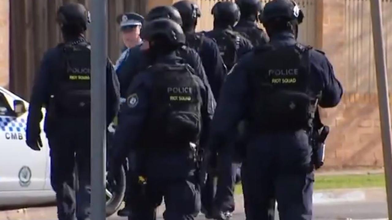 Riot Squad police were visible in Chester Hill. Picture: 7 News