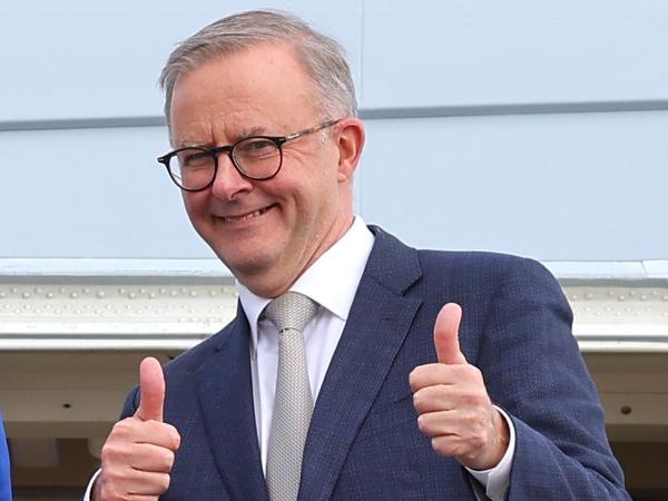 CANBERRA, AUSTRALIA - MAY 23: Prime Minister Anthony Albanese stands with newly appointed Foreign Minister Penny Wong, at the door of their plane on May 23, 2022 in Canberra, Australia. Albanese is travelling to Japan to attend the QUAD Leaders' meeting in Tokyo. Albanese was sworn in as Australia's 31st prime minister on Monday morning following his victory over Scott Morrison in the federal election on Saturday. (Photo by David Gray/Getty Images)