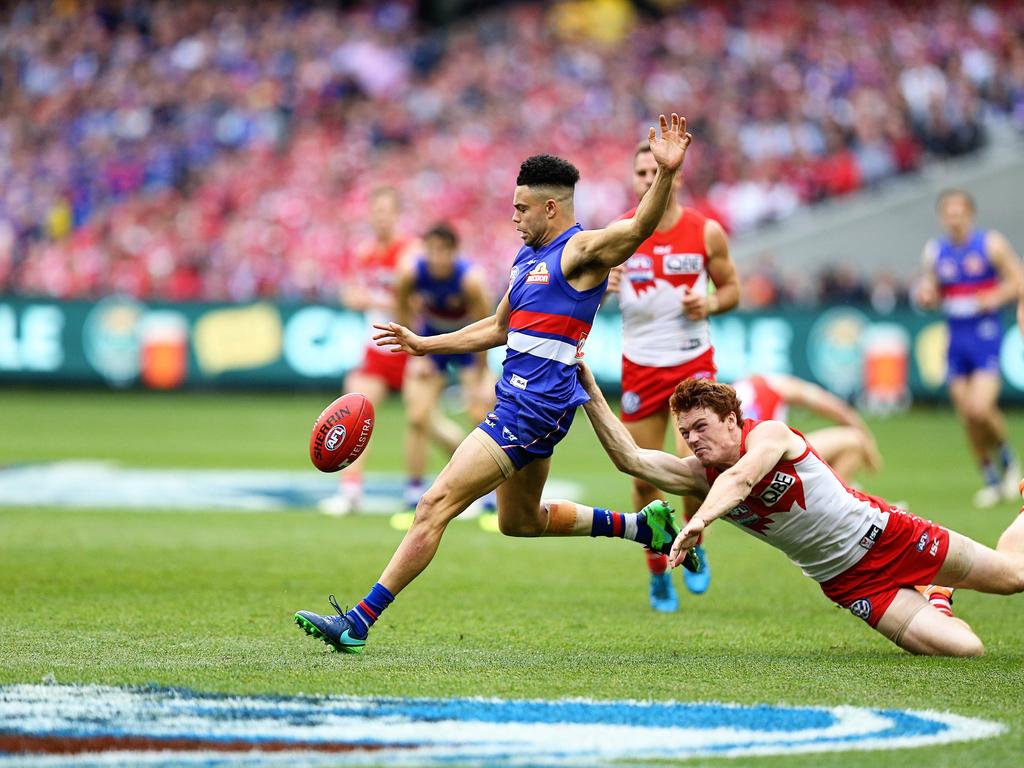 Western Bulldogs Jason Johannisen gets tackled by Sydney's Gary Rohan in the 2016 grand final. Picture: Tim Carrafa