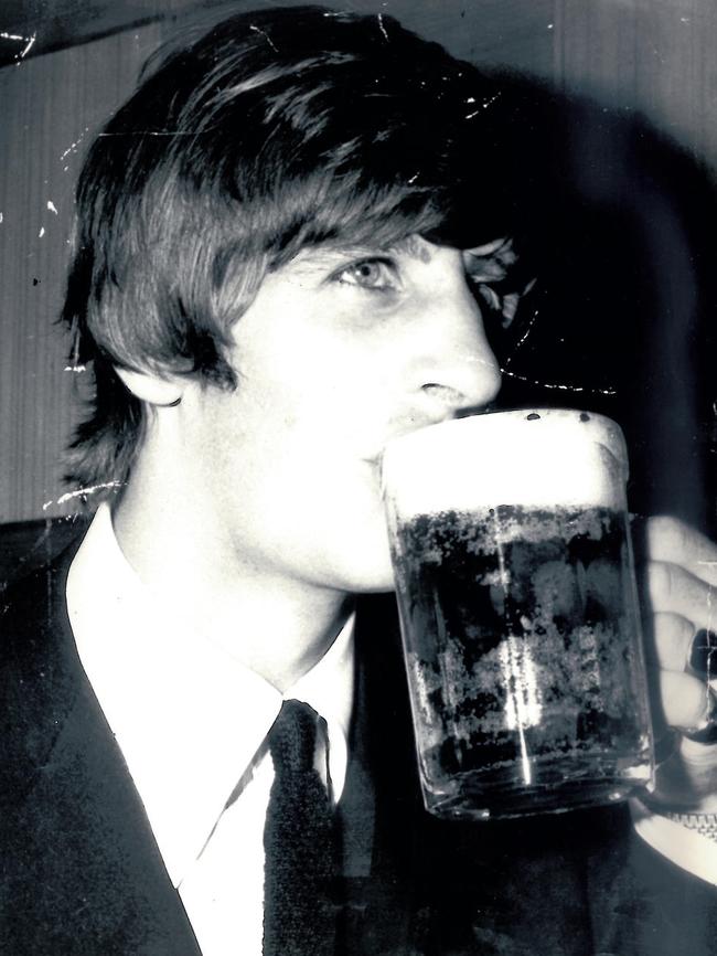 Ringo Starr from the Beatles enjoys an Australian beer in Australia in 1964. Picture: News Corp