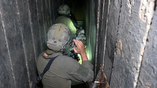 Israeli soldiers in a tunnel dug by Hamas militants inside the Al-Shifa hospital complex in Gaza City. Picture: AFP