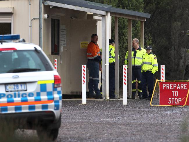 Police at the Mount Lyell mine site entrance