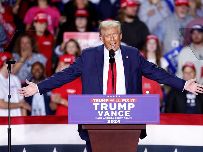 (FILES) Former US President and Republican presidential candidate Donald Trump speaks during a campaign rally at Van Andel Arena in Grand Rapids, Michigan on November 5, 2024. Buckle up: Donald Trump returns to the White House next week for a second term that promises to be even more volatile -- and hard-line -- than his roller-coaster first presidency. Buoyed by his historic political comeback, the billionaire Republican has shown no sign of changing the bombastic style that shook the United States and the world from 2017 to 2021. (Photo by KAMIL KRZACZYNSKI / AFP)