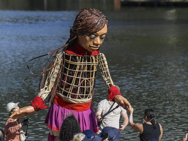 ADELAIDE, AUSTRALIA - NewsWire Photos MARCH 15 2024:  Little Amal puppet arrives in Adelaide.  Little Amal arrives by boat on the river Torrens.Picture: NCA NewsWire / RoyVphotography