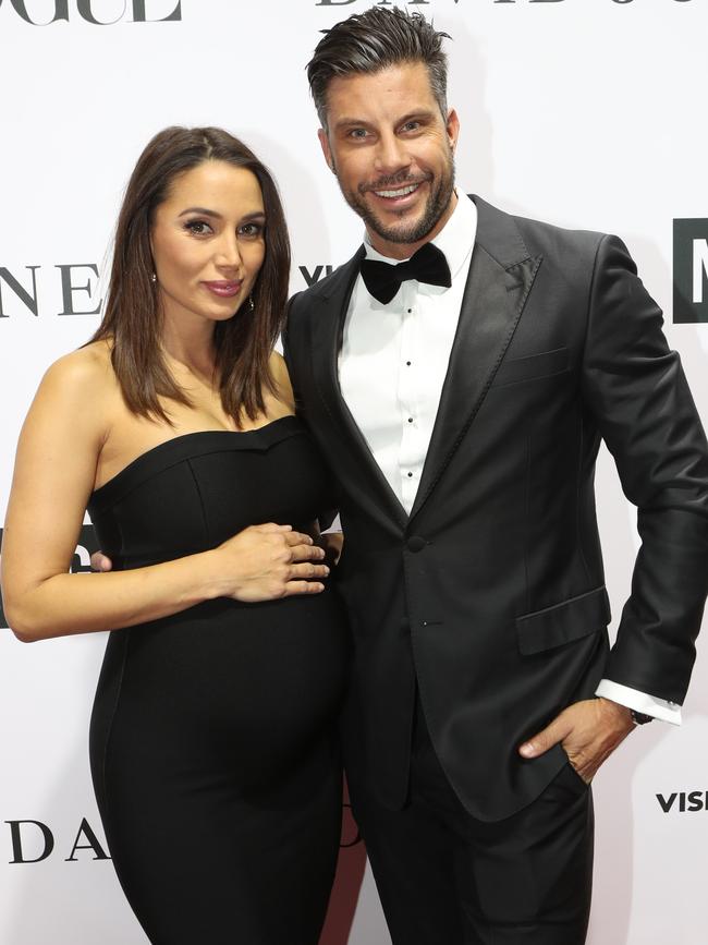 Sam Wood and Snezana Markoski pose for pictures on the red carpet. Picture: AAP Image/David Crosling