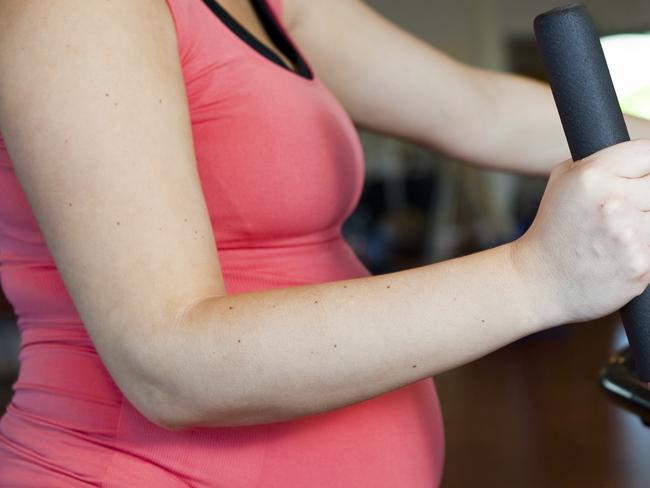 Generic photo of a pregnant woman exercising. Picture: iStock
