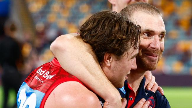 BRISBANE, AUSTRALIA - MAY 18: Tom Sparrow of the Demons and Simon Goodwin, Senior Coach of the Demons celebrate during the 2025 AFL Round 10 match between the Brisbane Lions and Narrm (Melbourne Demons) at The Gabba on May 18, 2025 in Brisbane, Australia. (Photo by Russell Freeman/AFL Photos via Getty Images)