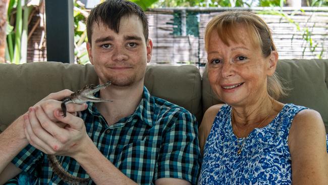 Airbnb owner Sarah Weatherhead-Kous and son Alex Kous with croc Brutus at their Rapid Creek home. Picture: Pema Tamang Pakhrin