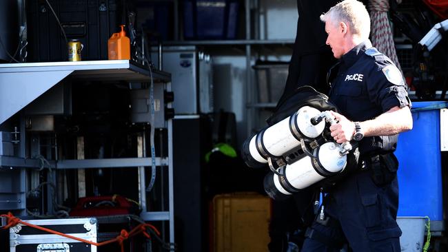 Police divers will work to recover the bodies from the wreckage. Picture: Peter Lorimer