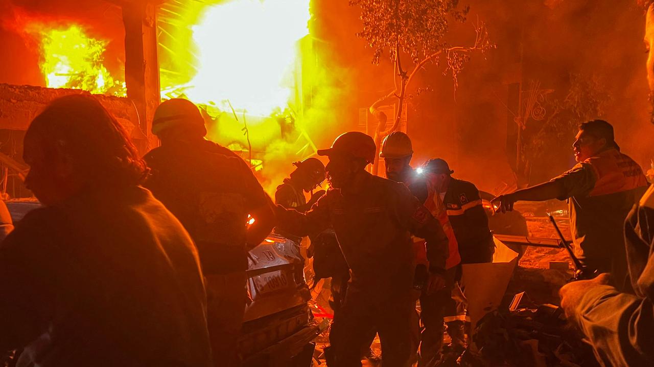 Lebanese emergency services arrive as a fire burns at the site of the strike. Picture: Ibrahim Amro/AFP