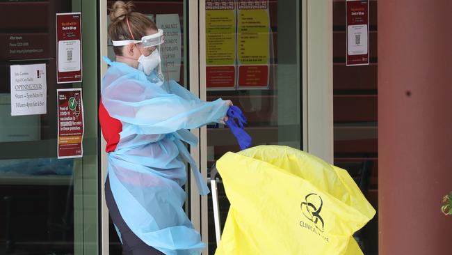 Staff in PPE in the midst of the deadly outbreak. Photo: Annette Dew