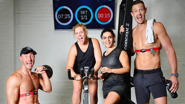 Body Fit Training owner Matt Thomas, Anita Schmidt, Golsa Adabi and owner Daniel Stewart working out at the studio. Picture: Nicki Connolly