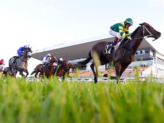 Jockey Jeff Lloyd rides Care To Think to win race 9, the Class 6 Plate, during the Doomben Race Day at the Doomben Racecourse in Brisbane, Saturday, December 16, 2017. (AAP Image/ Albert Perez) NO ARCHIVING, EDITORIAL USE ONLY