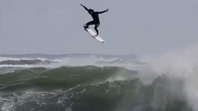 Surfer defies laws of gravity