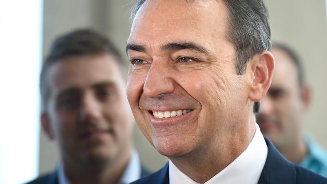 Winners are grinners: SA's Premier elect Steven Marshall at Henley Square this morning.