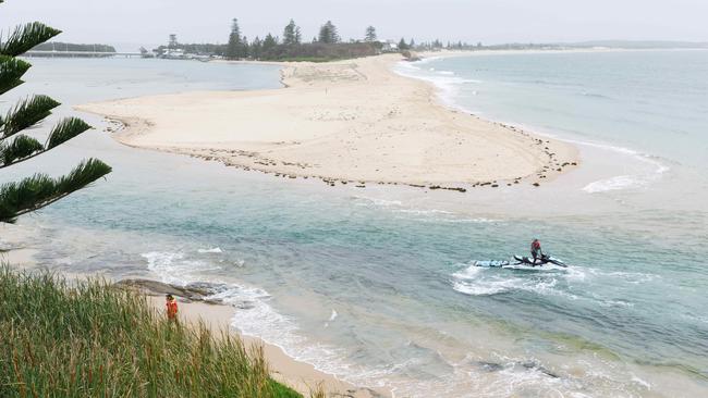 A jet ski in the search for a missing 11 year old boy swept out to sea last night while wading across this channel at low tide. Picture: Max Mason-Hubers