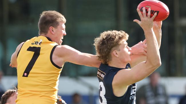 South Adelaide’s Sam Skinner gets the better of this marking contest against Glenelg’s Luke Reynolds at Noarlunga Oval. Picture: SANFL Image/David Mariuz