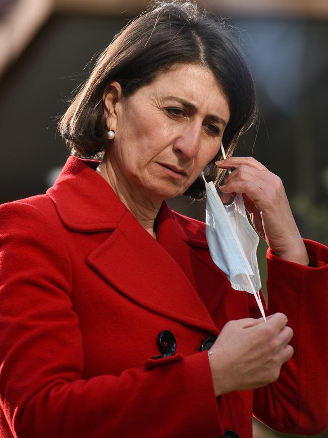 Saturday: Gladys Berejiklian in a fire engine red coat. Picture: NCA NewsWire / Flavio Brancaleone