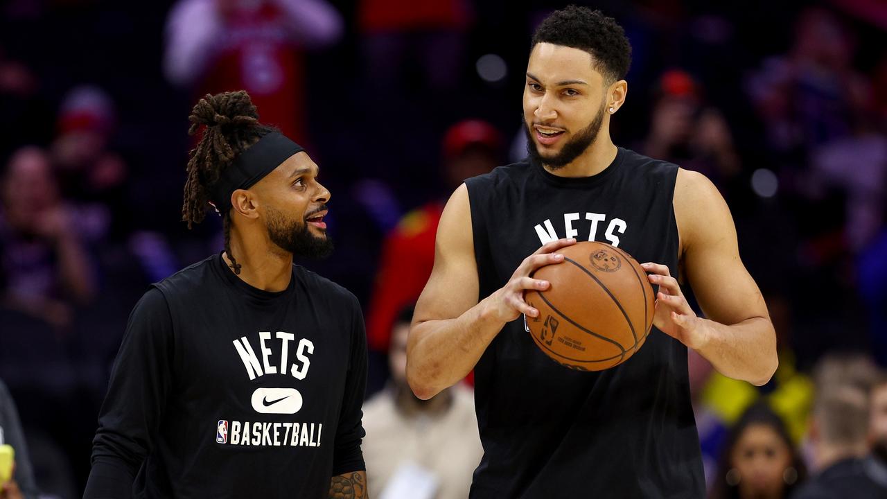 Patty Mills and Ben Simmons on the court together. Photo by Elsa/Getty Images.