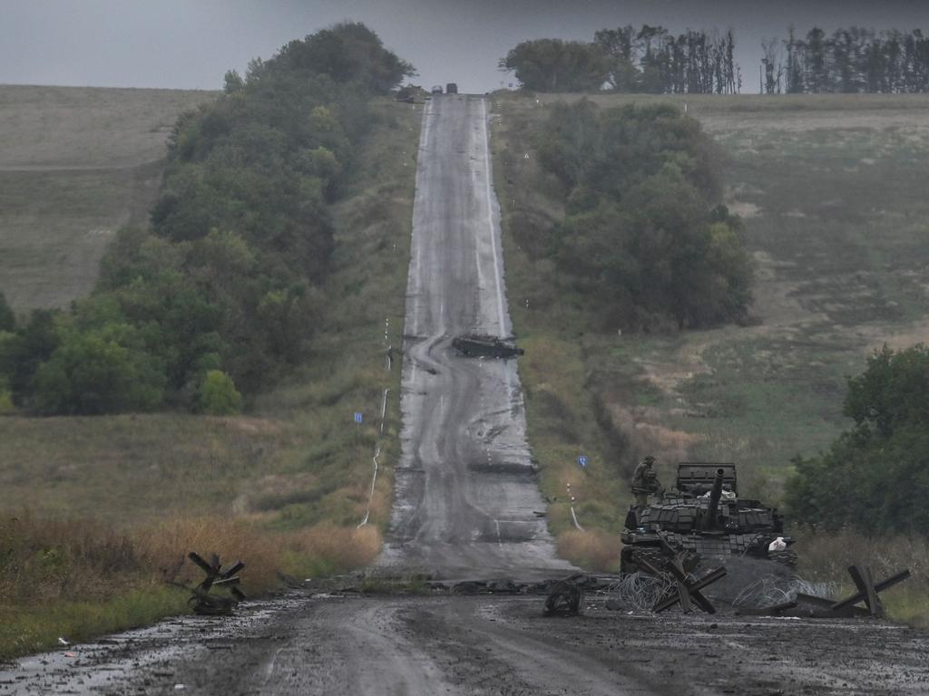 A Ukrainian soldier stands atop a tank on the outskirts of Izyum, Kharkiv Region, eastern Ukraine on September 14, 2022, amid the Russian invasion of Ukraine.