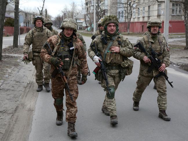 Servicemen of Ukrainian Military Forces walk in the small town of Severodonetsk, Donetsk Region. Picture: AFP