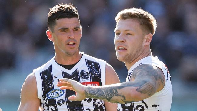 MELBOURNE, AUSTRALIA - MAY 18: Jordan De Goey of the Magpies celebrates a goal with teammate Scott Pendlebury during the 2024 AFL Round 10 match between The Collingwood Magpies and Kuwarna (Adelaide Crows) at The Melbourne Cricket Ground on May 18, 2024 in Melbourne, Australia. (Photo by Dylan Burns/AFL Photos via Getty Images)