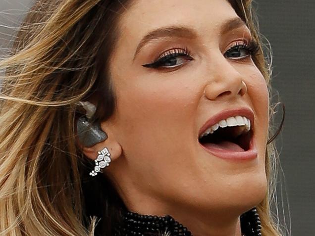 IPSWICH, AUSTRALIA - NOVEMBER 27: Delta Goodrem looks on during the 2022 AFLW Season 7 Grand Final match between the Brisbane Lions and the Melbourne Demons at Brighton Homes Arena, Springfield, Ipswich on November 27, 2022 in Ipswich, Australia. (Photo by Dylan Burns/AFL Photos via Getty Images)