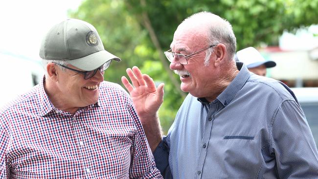 Prime Minister Scott Morrison is greeted like an old friend by Member for Leichhardt Warren Entsch on his arrival in Cairns. The Federal Government announced a $10 billion guarantee for a Northern Australia reinsurance pool at The Woolshed. Picture: Brendan Radke