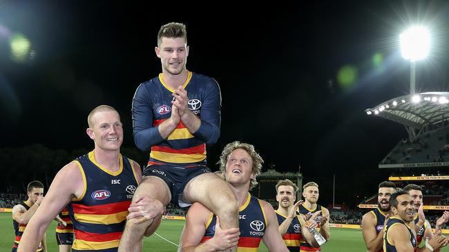 Bryce Gibbs gets chaired off in his 250th game by Sam Jacobs and Rory Sloane. Picture SARAH REED